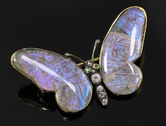 An early 20th century 15ct gold, garnet, diamond and butterfly wing set butterfly brooch, 38mm.
